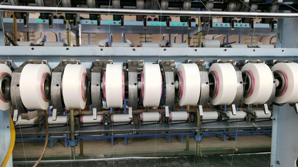 Challenges in the Production of Covered Spandex Yarn